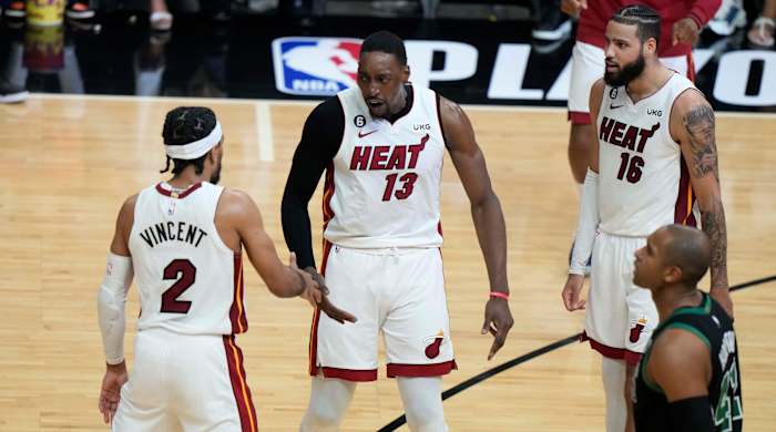 Heat players celebrate against the Celtics.